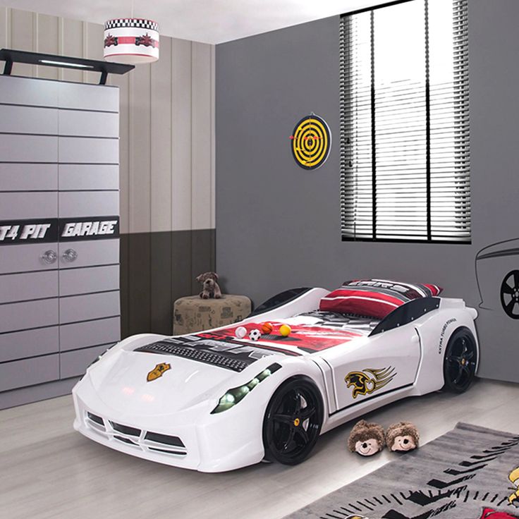 a bedroom with a car themed bed in it