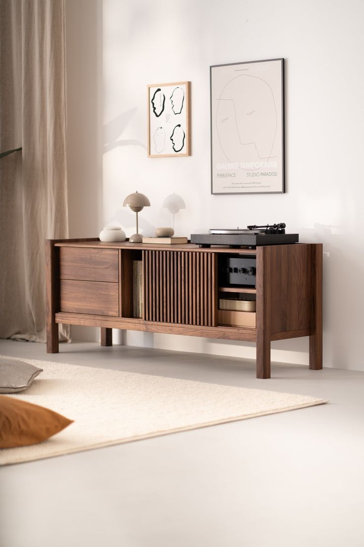 an entertainment center with a record player and speakers