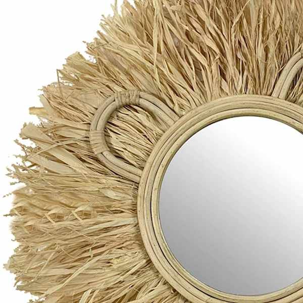 a mirror that is made out of straw