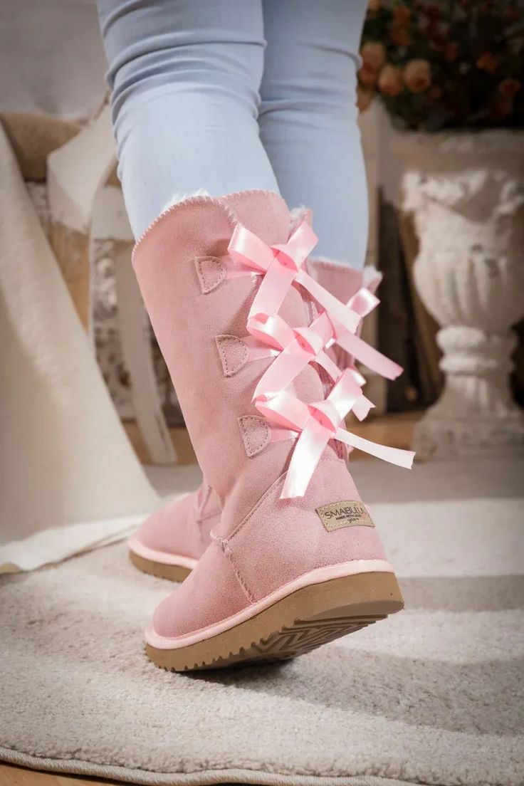 SMAIBULUN Ugg | TRI RIBBON BOW SUEDE BOOTS - PINK Luxury Pink Boots For Fall, Ribbon Red Ugg, Pink Ugg Boots Zappos, Pink Ugg Boots Nordstrom, Aka Ugg Boots, Pink Slipper Boots, Ugh Boots Pink, Pink Ugg Boots Ugg, Pink Ugg With Bows