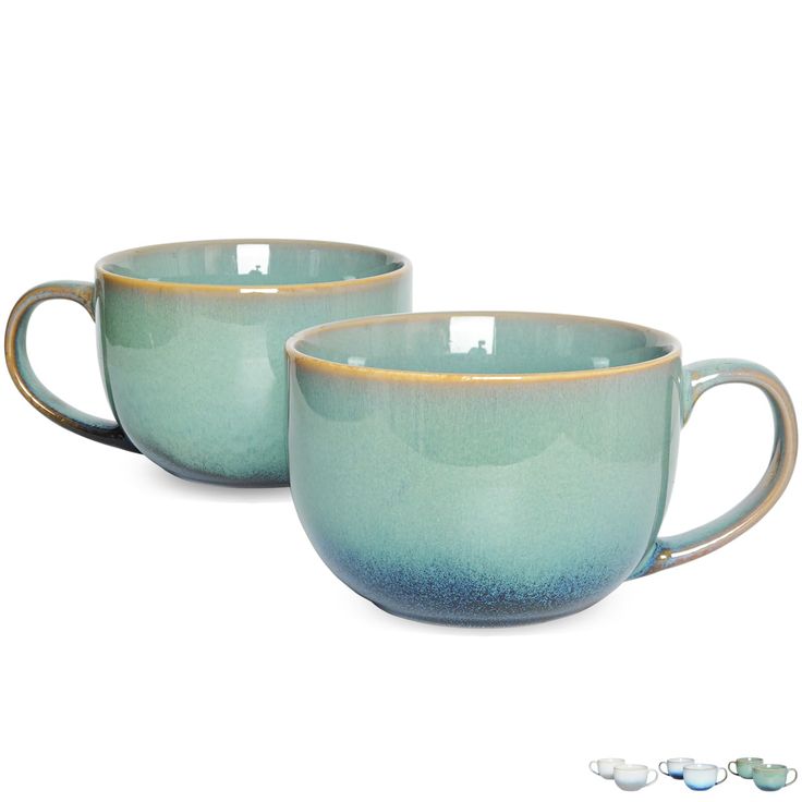 two blue coffee cups sitting next to each other