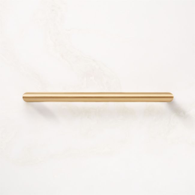 a gold colored handle on a white wall