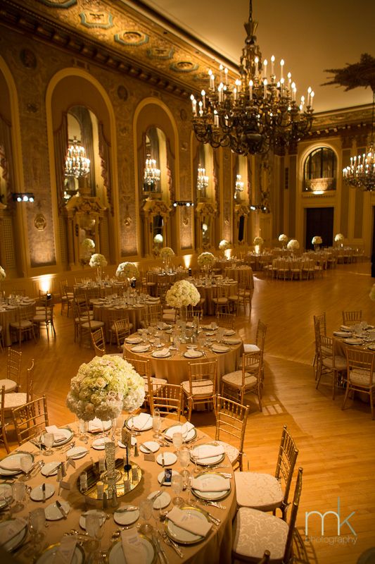 an elegant ballroom with chandeliers and tables set up for formal dinnereons