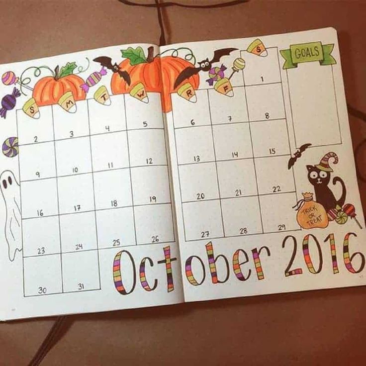 an open halloween calendar with pumpkins on it