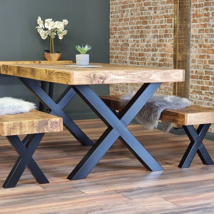 a wooden table with two benches next to it