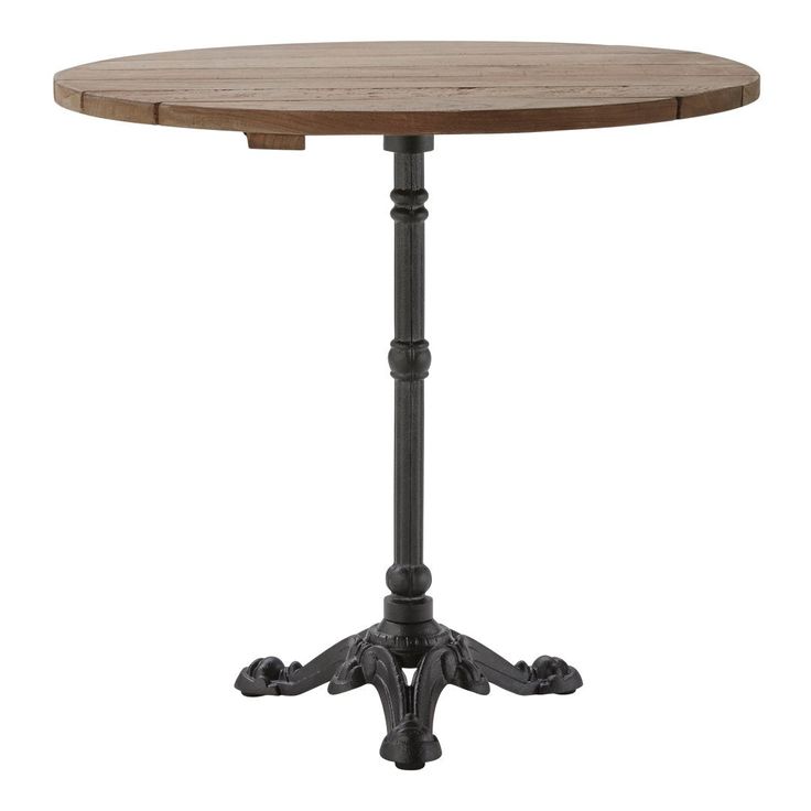 a round wooden table with metal legs and an ornate design on the top, against a white background