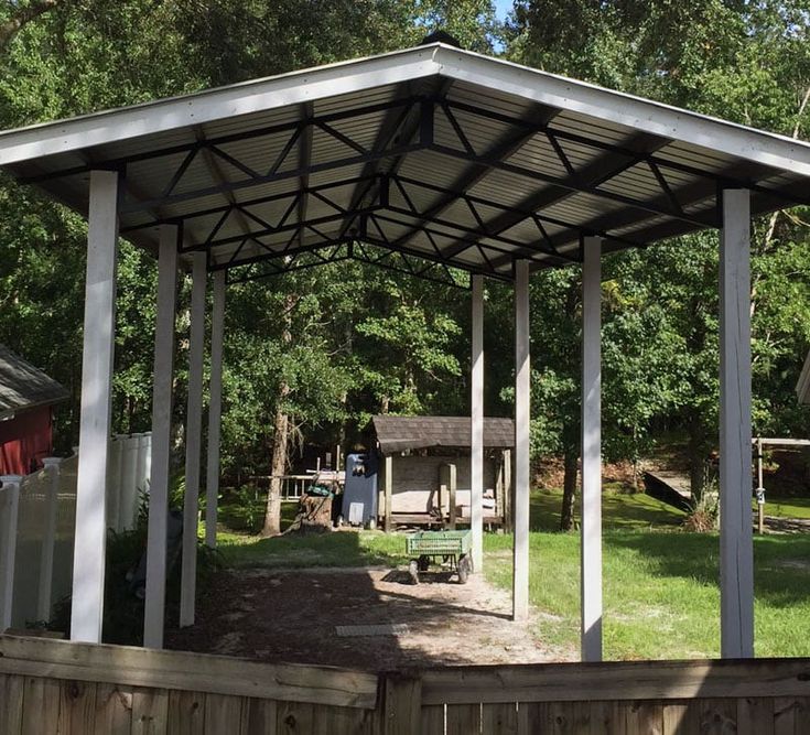 a covered picnic area in the back yard