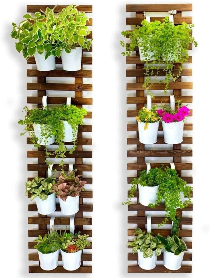 two vertical planters filled with different types of plants