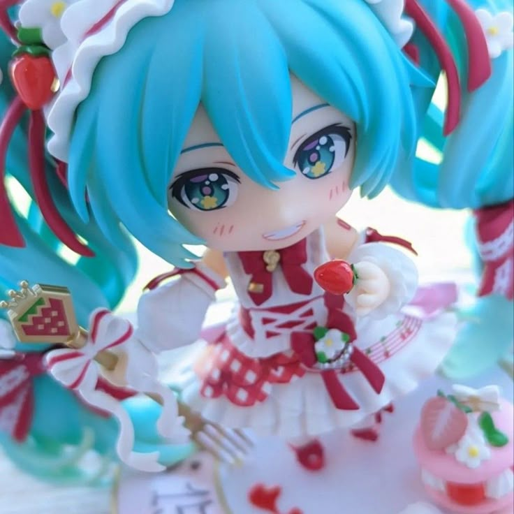 a close up of a figurine wearing a dress and holding a fork in her hand