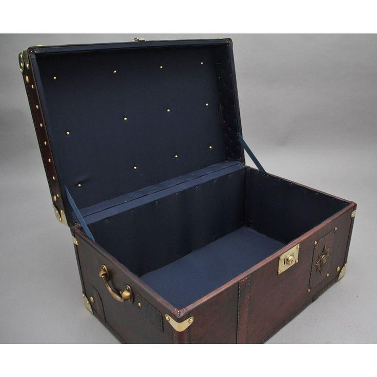 A fabulous early 20th century leather bound ex army trunk with brass straps and corners, copper studs and brass carrying handles on the sides, the trunk opens to reveal a nice dark blue lined interior, on the front of the trunk there is the regimental badge which belongs to the Grenadier Guards. This trunk is in excellent condition and would be ideal as coffee / end table. Circa 1930. Grenadier Guards, Vintage Side Table, Vintage Suitcase, Early 20th Century, End Tables, Trunk, 20th Century, Side Table, Dark Blue