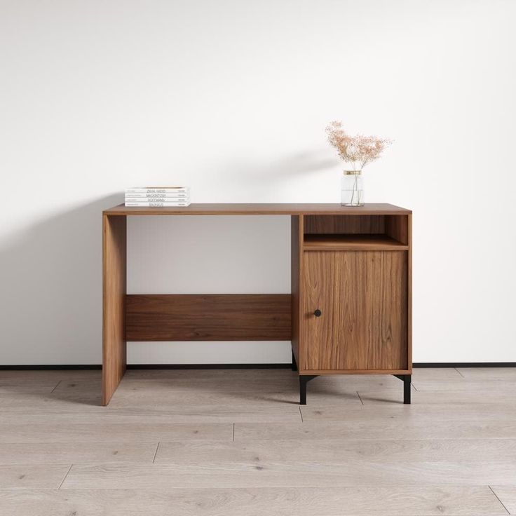 a wooden desk with a vase on top of it