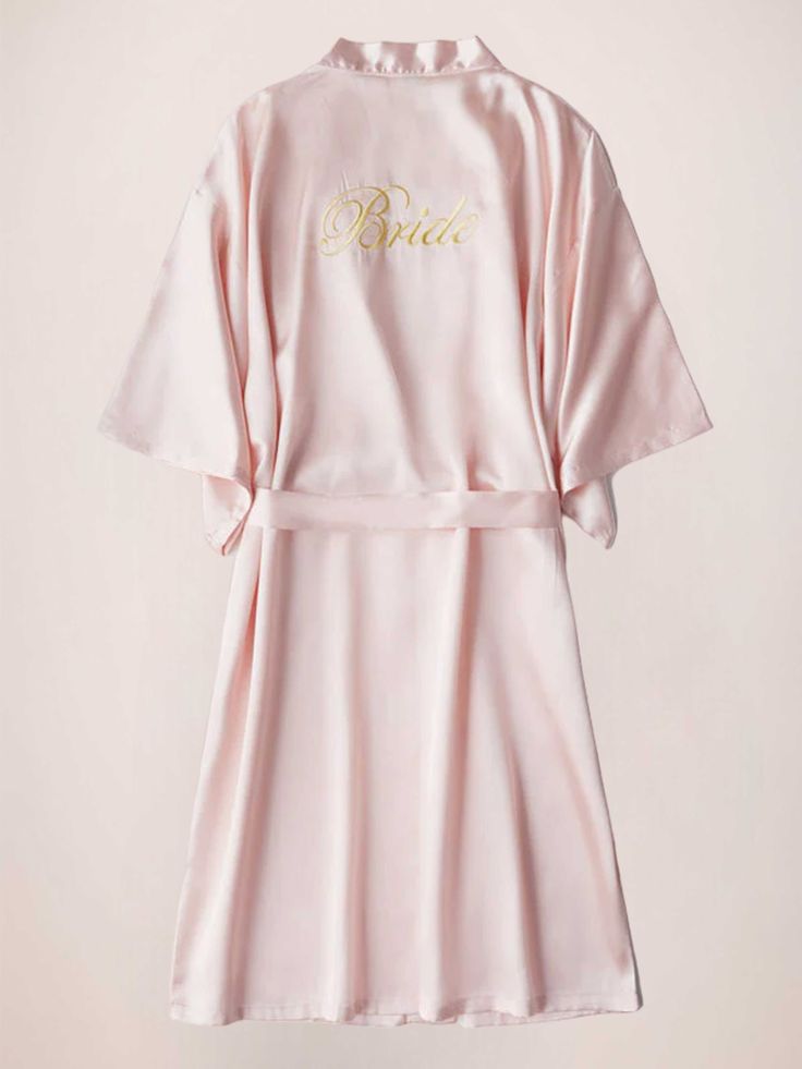 a pink robe with the word bride written on it