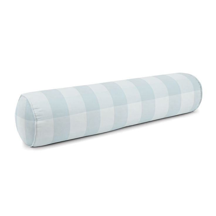 a blue and white striped pillow on a white background