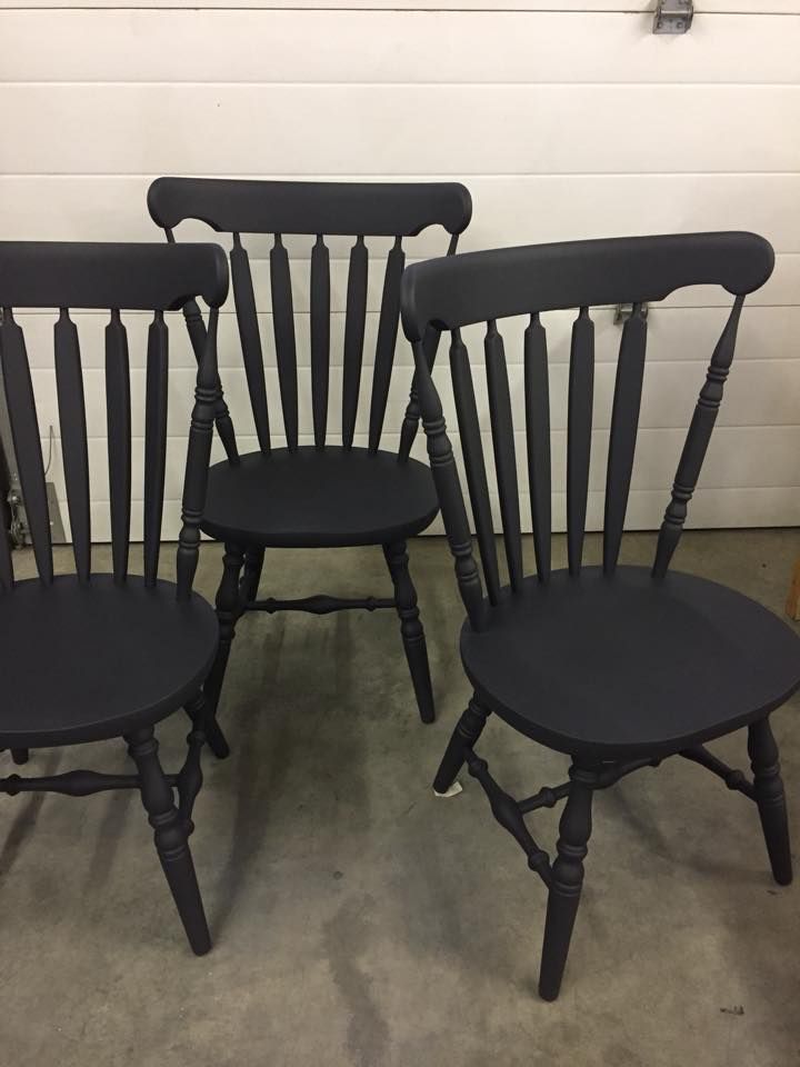 three black chairs sitting next to each other