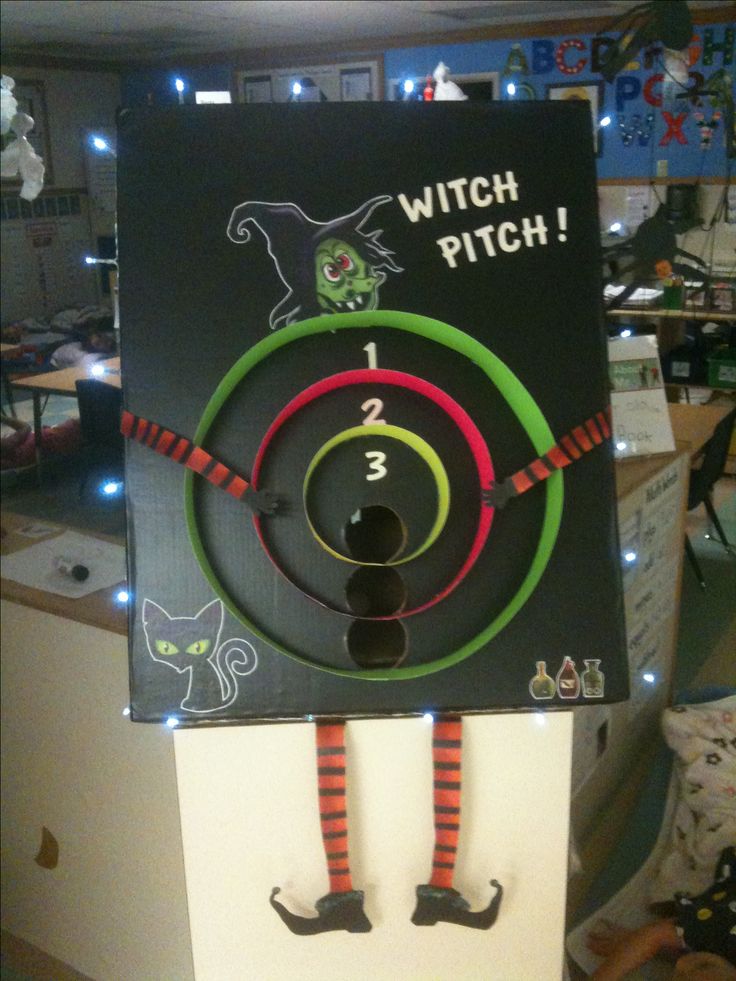 a sign that says witch pitch on the front and back of it with an image of a cat in the hat