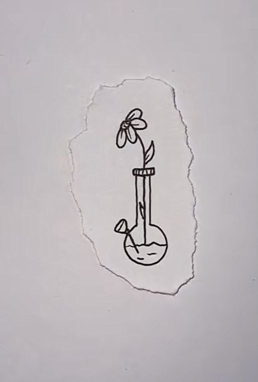 a piece of paper with a drawing of a flower in a vase on the wall