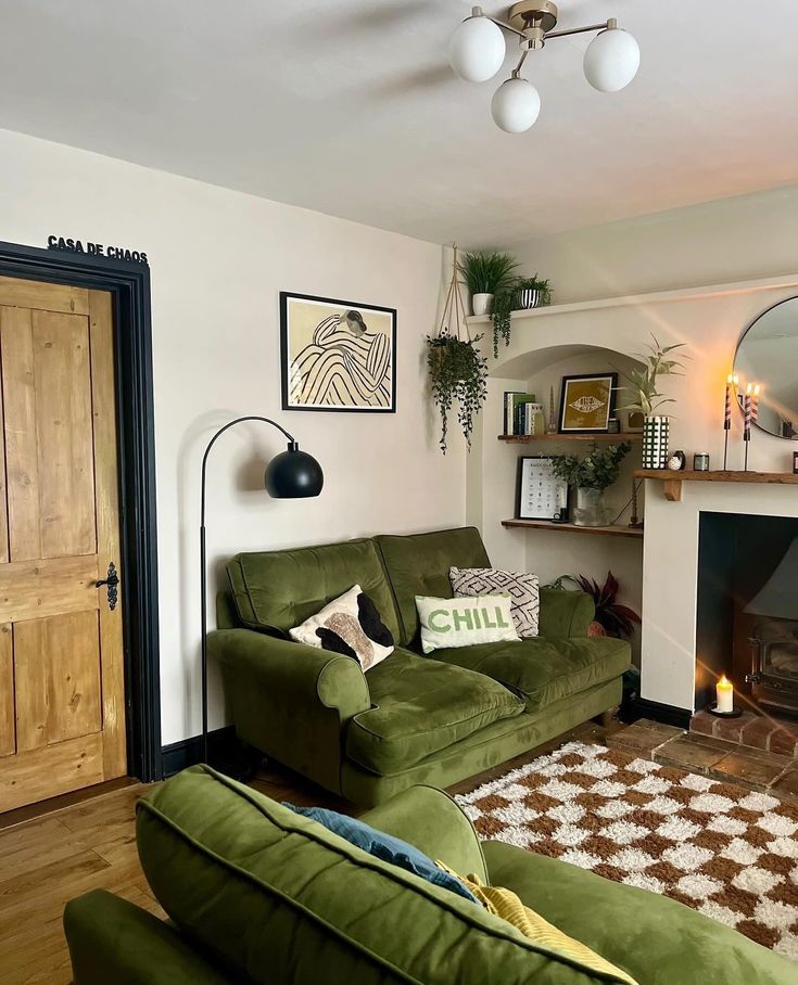 a living room filled with furniture and a fire place