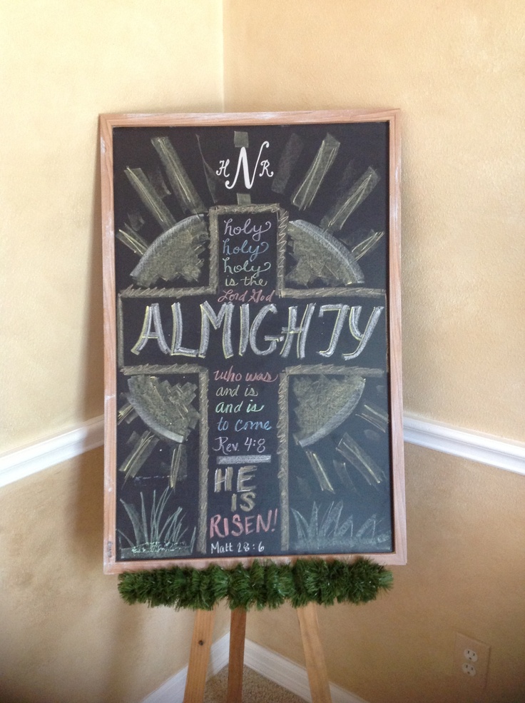 a chalkboard sign with the words al mighty written on it in front of a wall