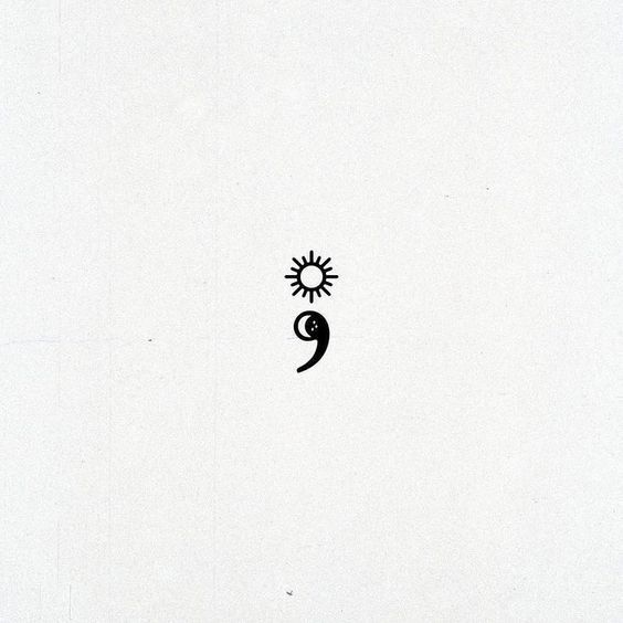 a black and white drawing of a sun with a face on it's side