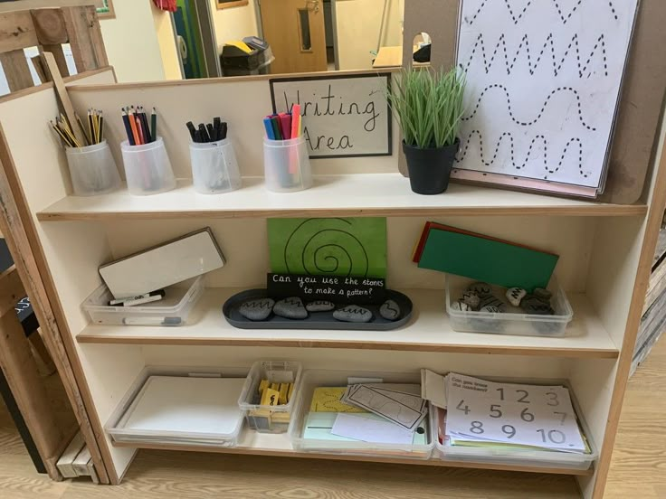 a book shelf filled with lots of books and office supplies