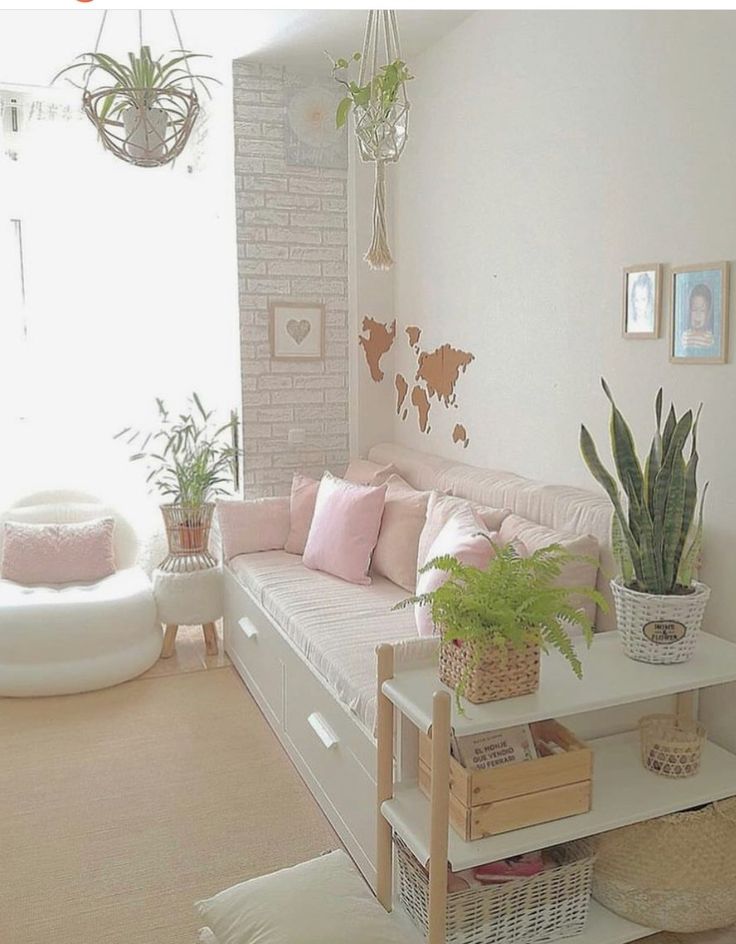 a living room filled with lots of furniture and plants on top of it's shelves