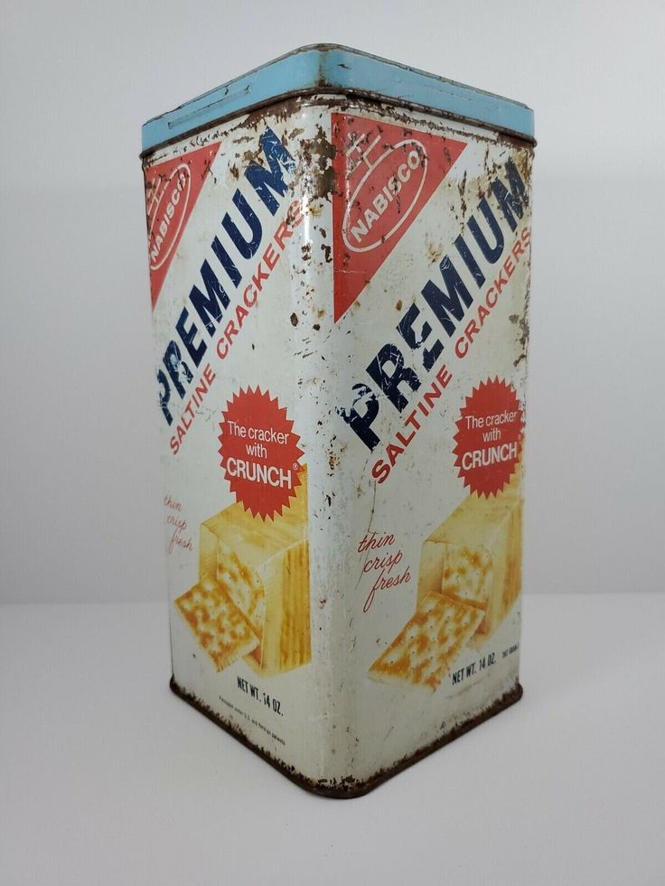 an old tin can with crackers on it