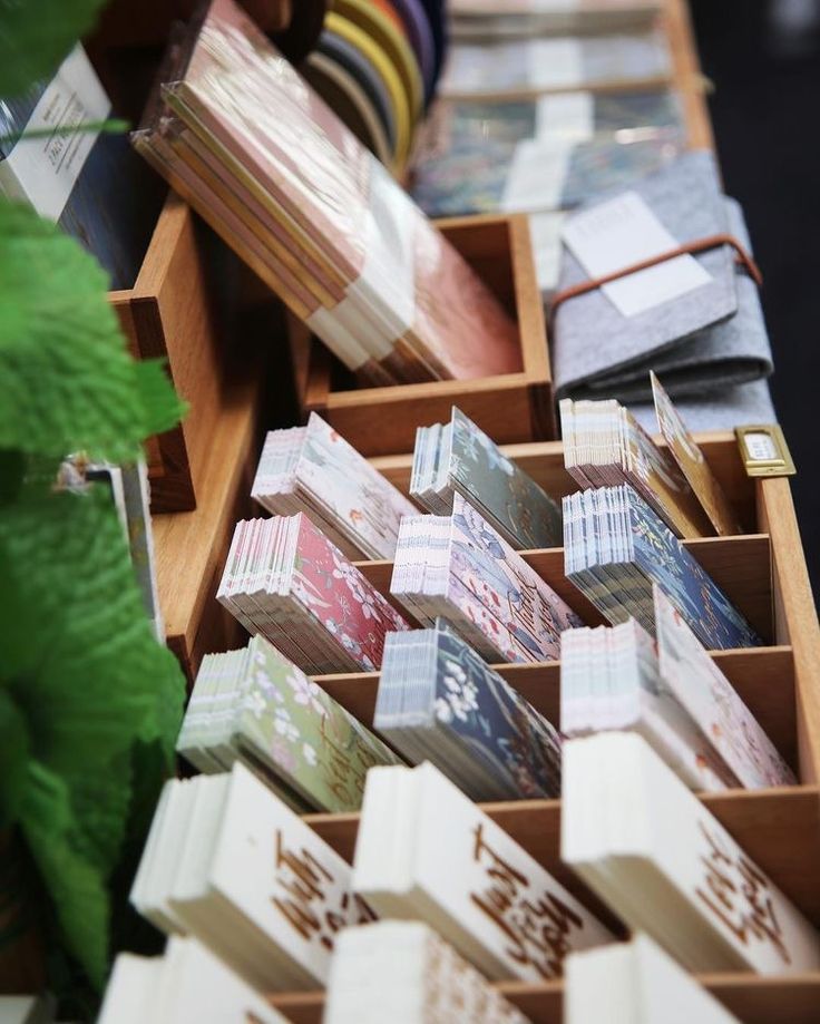 several wooden boxes filled with different types of cards