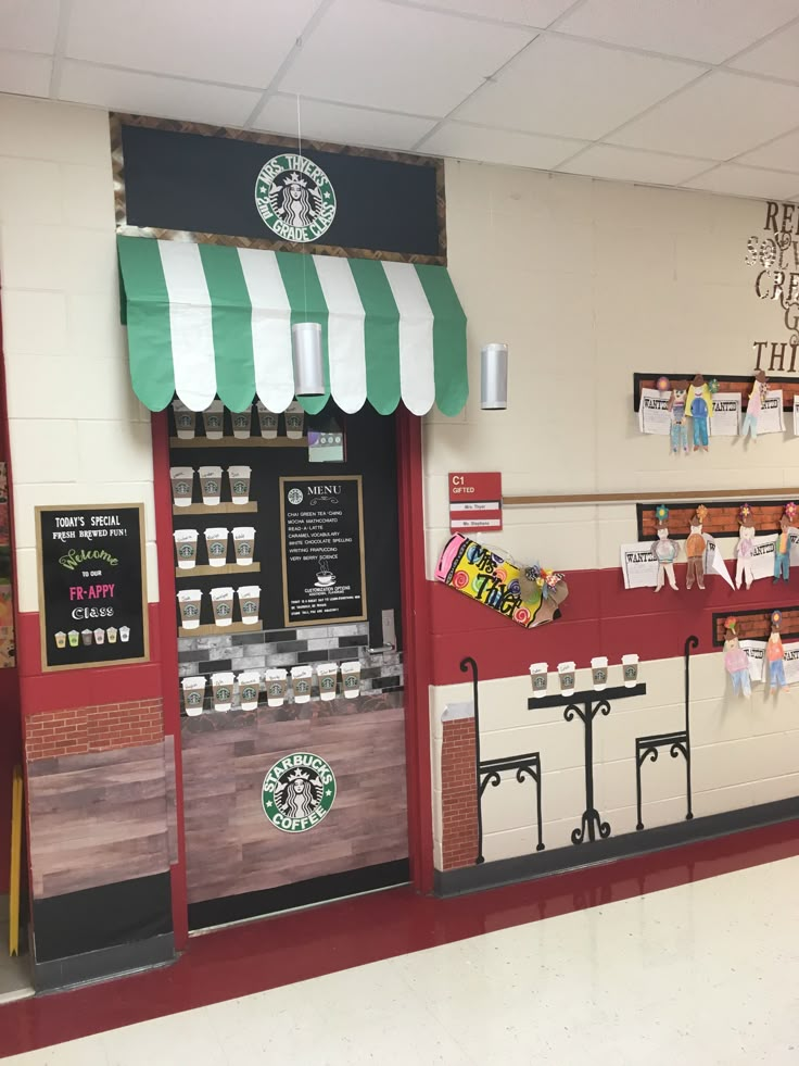 the inside of a starbucks coffee shop with red and white striped awnings on the windows