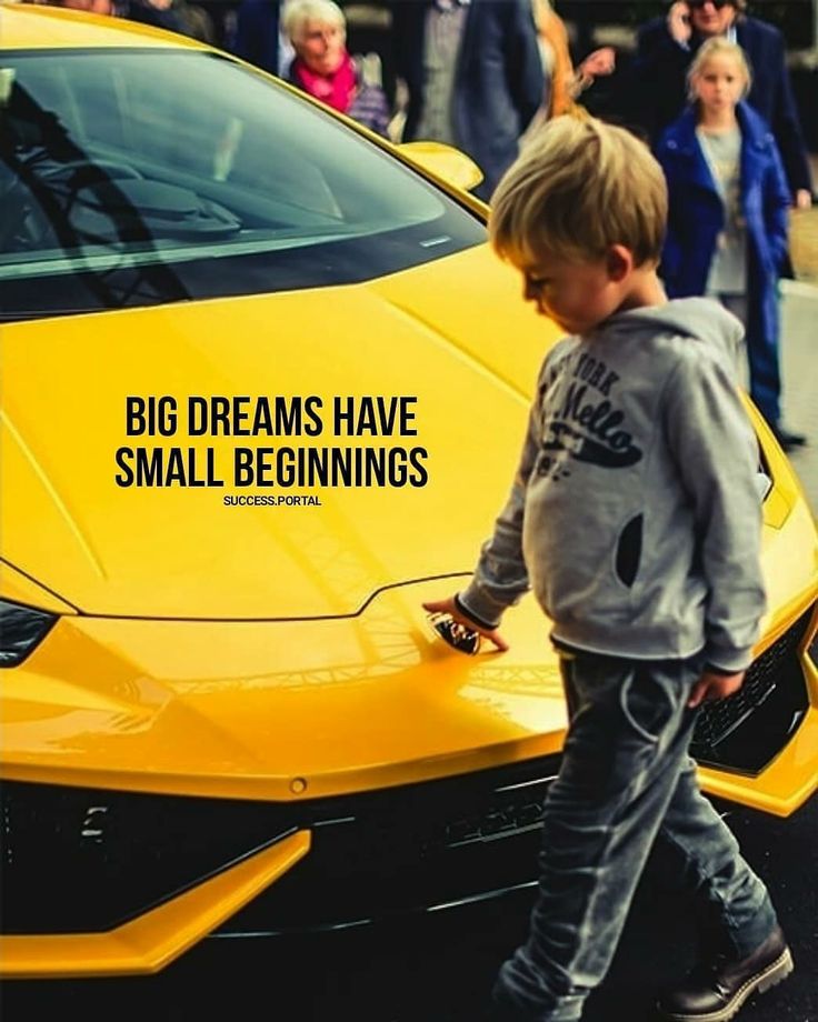 a little boy standing next to a yellow car with the words big dreams have small beginnings