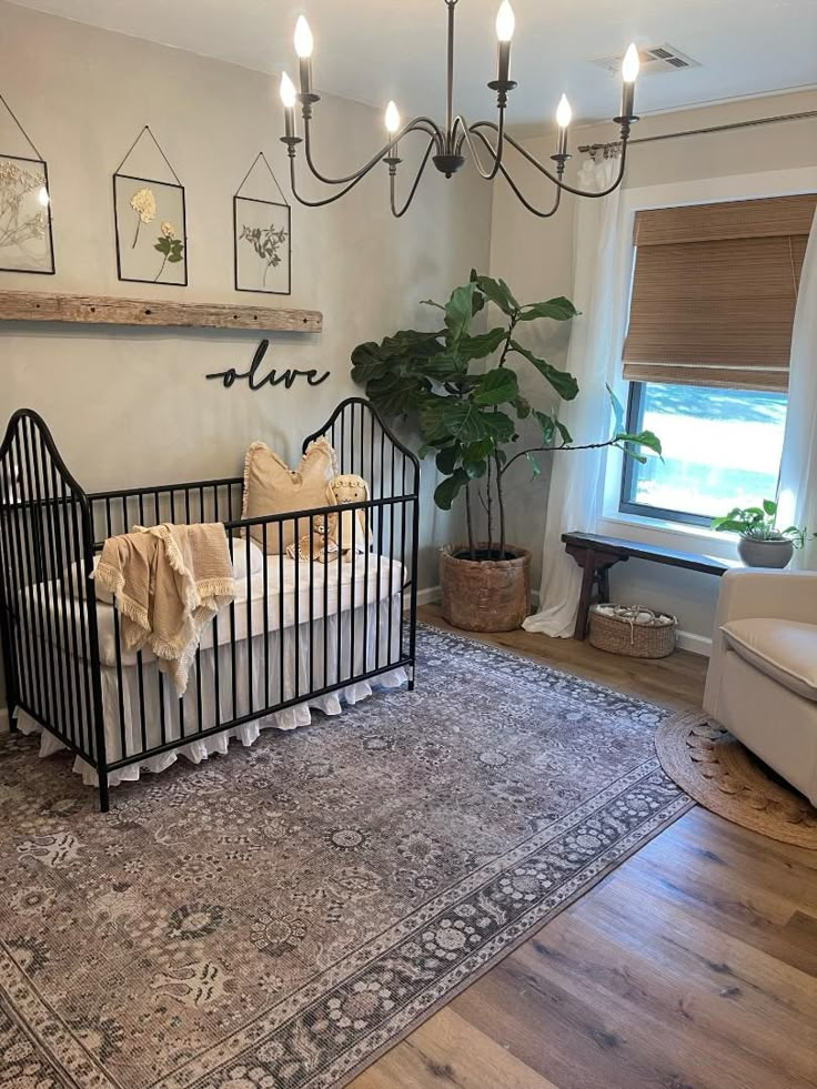 a baby crib in the corner of a room with a rug on the floor