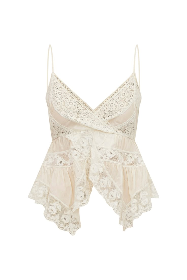 Loving on the Luschia Top. Designed from a silky viscose habotai fabric, this vintage-inspired top is all in the details with a stunning medley mix of laces and shirring details all over. This sexy cami top has an overlapping, sweepy peplum and handkerchief silhouette. Delicate, floral laces arrive at the sweep and the bodice. The evening-to-day top includes a zipper for functionality. Vintage Cami, Blusas Top, Lace Cami Top, White Lace Top, Lace Cami, Cami Top, Lace Tops, Cami Tops, Cute Tops