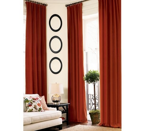 an image of a living room with red curtains