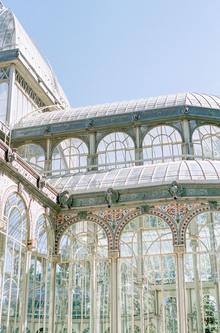 the inside of a glass house with many windows