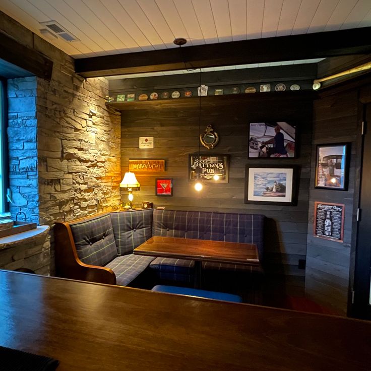 a restaurant with stone walls and wooden tables