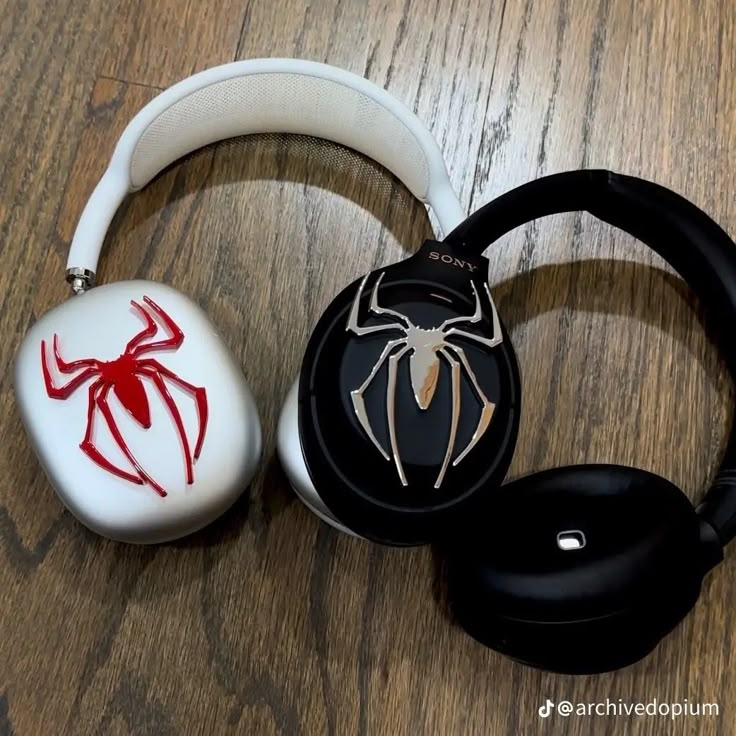 two headphones with spiderman designs on them