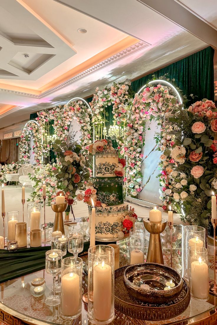 an elaborately decorated table with candles and flowers