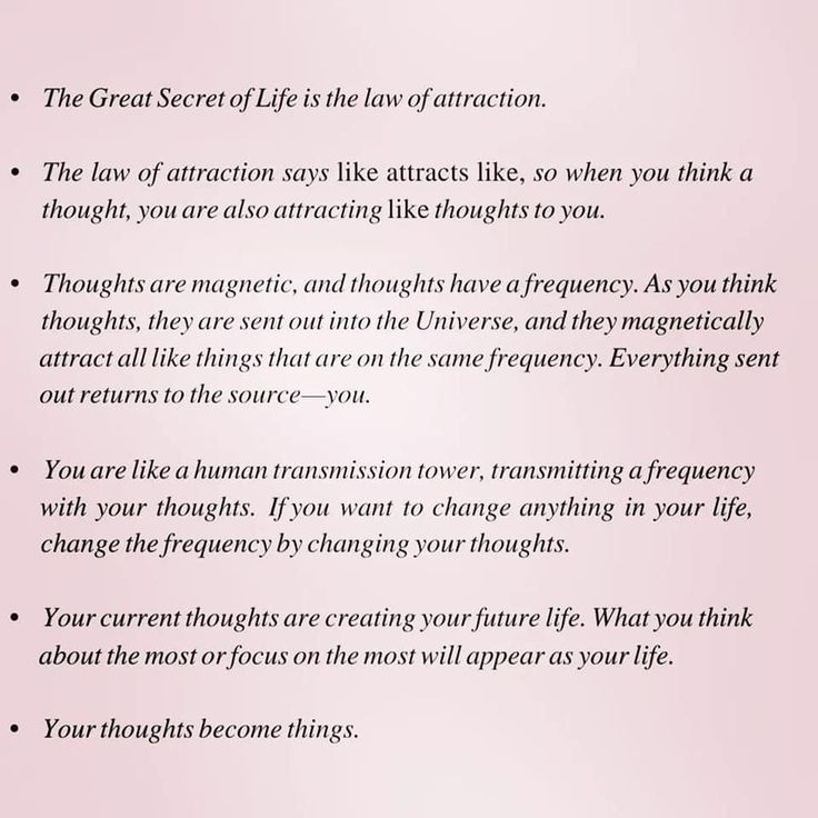 the great secret of life is the law of attraction text on pink paper with black writing