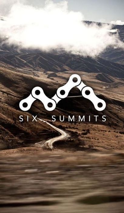 the logo for six summits is shown on top of a mountain with clouds in the background