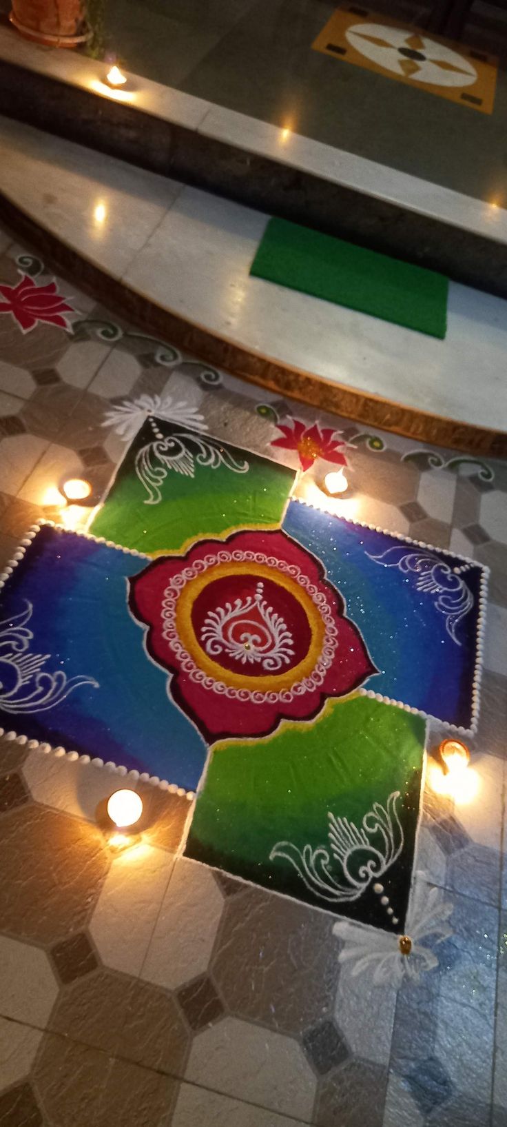 a decorated floor with lit candles on it