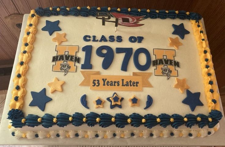 a cake that is decorated with stars and the words class of 1970