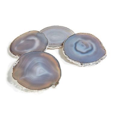 three agate shell coasters sitting on top of each other