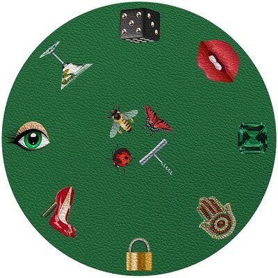 a green circle with lots of different things on it's face and some dice