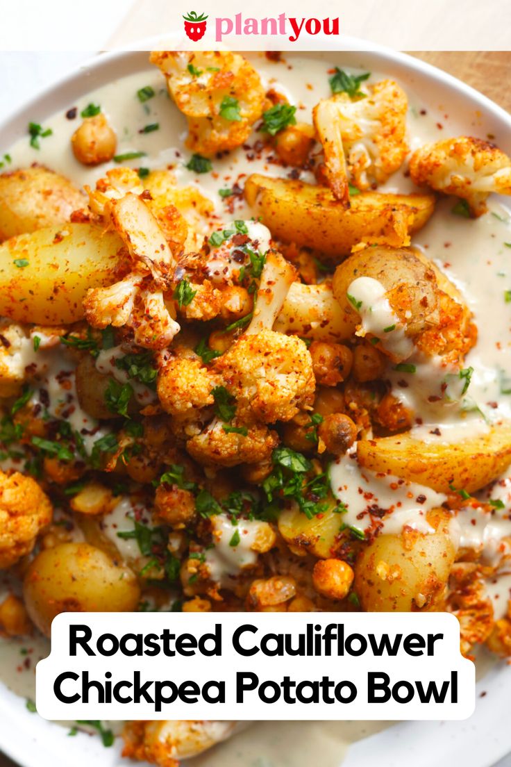 roasted cauliflower and chickpea potato bowl with ranch dressing on the side