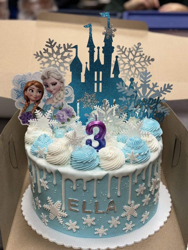 a frozen princess birthday cake with frosting and decorations