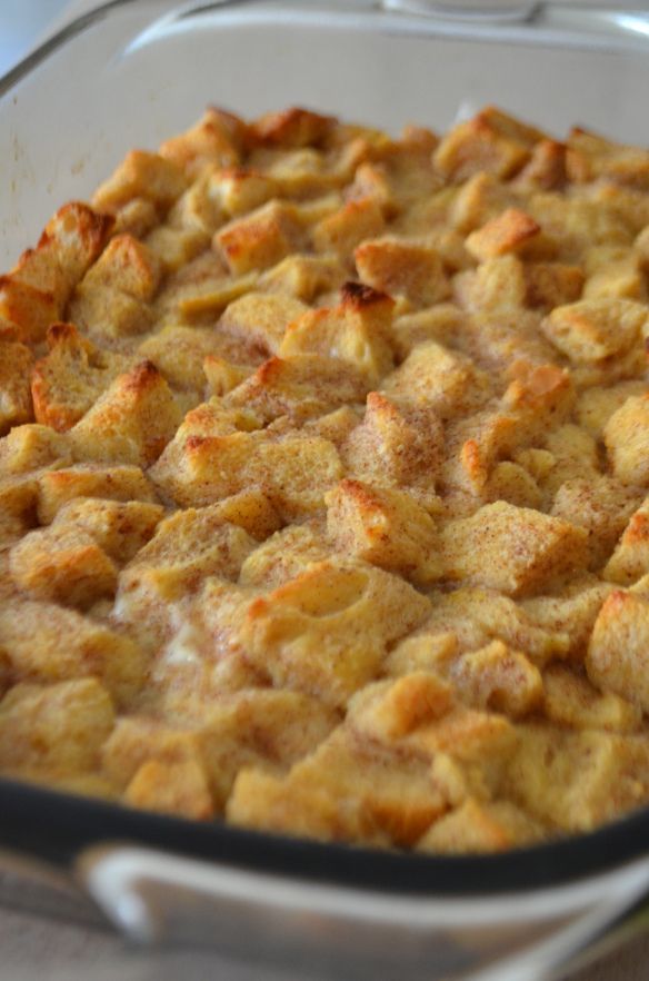 a casserole dish filled with bread cube toppings