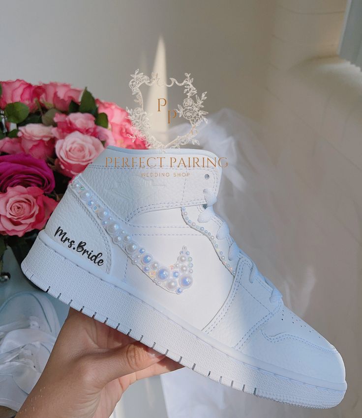 DESCRIPTION: Welcome! I've had years of experience in creating unique custom sneakers, but recently have discovered a newfound passion for designing special sneakers for brides! Reflecting on my wedding, I remember the agony and pain of wearing uncomfortable shoes that didn't match my dress.  Recently, one of my best friends was getting married and was facing the same issue, so I decided to surprise her with a custom pair of sneakers that would ensure she was comfortable enough to dance all nigh Sneakers For Bride, Wedding Sneakers For Bride, Bride Shoes Wedding, Jordan Aesthetic, Wedding Bride Shoes, Jordan Air Max, Nike Air Jordan Mid, Sneakers Wedding, Bride Sneakers