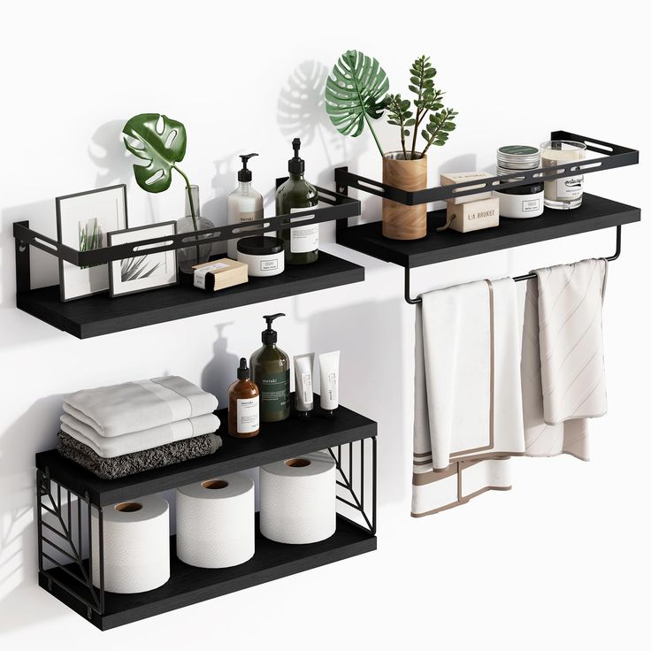 two black shelves with towels and other bathroom items