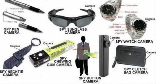 the contents of a man's personal belongings including sunglasses, camera, spy watch and other items