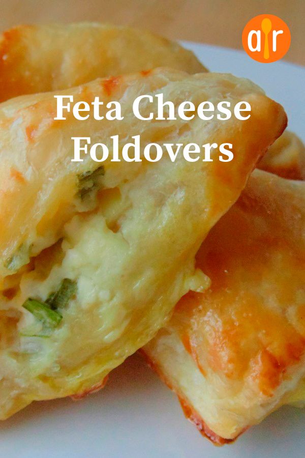 some food is on a white plate with the words feta cheese foldovers