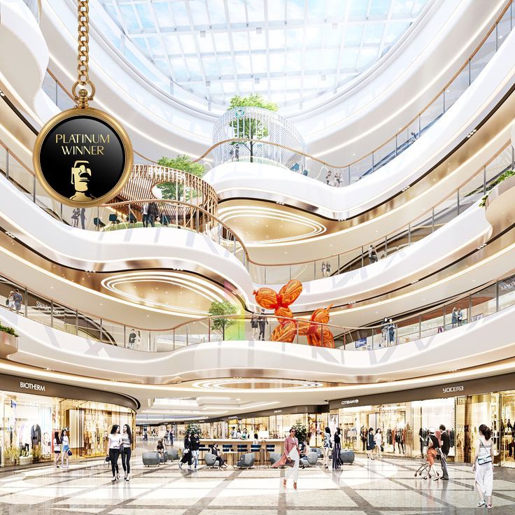 the inside of a shopping mall with people walking around and shops on the second floor